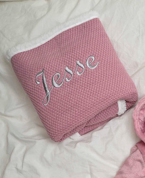 Babies Dusky Pink knitted blanket is super soft and thick, perfect for keeping your little one warm and cosy. With a sherpa lining to the back and embroidered personalisation to the front. Size 75x90cm.
