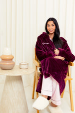 Load image into Gallery viewer, Girls plush maxi personalised dressing gown in a luxurious Burgundy colour. Made from super soft thick fabric, maxi length, large hood to the back and adjustable tie around the waist. Complete with a special touch of personalisation to the chest - this is embroidered especially for you. Making the perfect personalised gift for children.