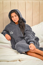 Load image into Gallery viewer, This ladies Charcoal long line over sizes hoody is made from a luxurious heavy weight bonded fabric and is fully borg lines throughout the entire hoody- making it a winter essential. With a hood, kangaroo pocket to the front and your personalised name embroidered to the chest.