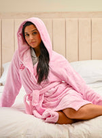 This ladies personalised dressing gown in Light Pink is made out of a luxurious, plush, super soft fabric, perfect for keeping you warm on a cold day. This dressing gown has a hood to the back, pockets on either side and a tie around the waist. This dressing gown can be personalised with any name you wish, for special requests please leave this in the notes section of your order. This will be embroidered. You can select the colour of the thread this will be personalised in.