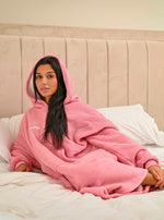 Load image into Gallery viewer, This ladies Pink long line over sizes hoody is made from a luxurious heavy weight bonded fabric and is fully borg lines throughout the entire hoody- making it a winter essential. With a hood, kangaroo pocket to the front and your personalised name embroidered to the chest.