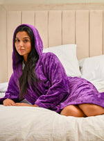 This ladies personalised dressing gown in Dark Purple is made out of a luxurious, plush, super soft fabric, perfect for keeping you warm on a cold day. This dressing gown has a hood to the back, pockets on either side and a tie around the waist. This dressing gown can be personalised with any name you wish, for special requests please leave this in the notes section of your order. This will be embroidered. You can select the colour of the thread this will be personalised in.