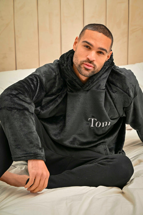 This mens Black over sized hoodie made from a super plush fabric with a Black borg lined hood for extra warmth. With a hood to the back and a kangaroo pocket to the front. Complete with your name embroidered to the chest. 