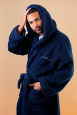 Load image into Gallery viewer, Mens premium maxi personalised dressing gown in a luxurious Navy colour with a charcoal contrast lined hood and front panel of the close of the dressing gown. Made from super soft thick fabric, maxi length, large hood to the back and adjustable tie around the waist. Complete with a special touch of personalisation to the chest - this is embroidered especially for you. Making the perfect personalised gift for him.