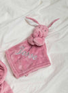 Our Babies personalised bunny comforter in Dusky Pink is crafted from super soft plush material, this comforter will keep your baby snug and content. Complete with your babies name personalised/embroidered to the front.