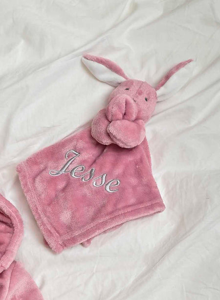 Our Babies personalised bunny comforter in Dusky Pink is crafted from super soft plush material, this comforter will keep your baby snug and content. Complete with your babies name personalised/embroidered to the front.