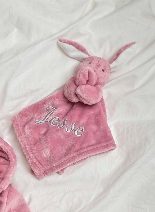 Our Babies personalised bunny comforter in Dusky Pink is crafted from super soft plush material, this comforter will keep your baby snug and content. Complete with your babies name personalised/embroidered to the front.