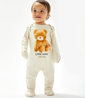 Babies sleep suit with fold over mits to the hands and footies to the bottom. Light Beige colour with a brown teddy design to the front and a personalised name underneath. Pop button fastening to the legs. 