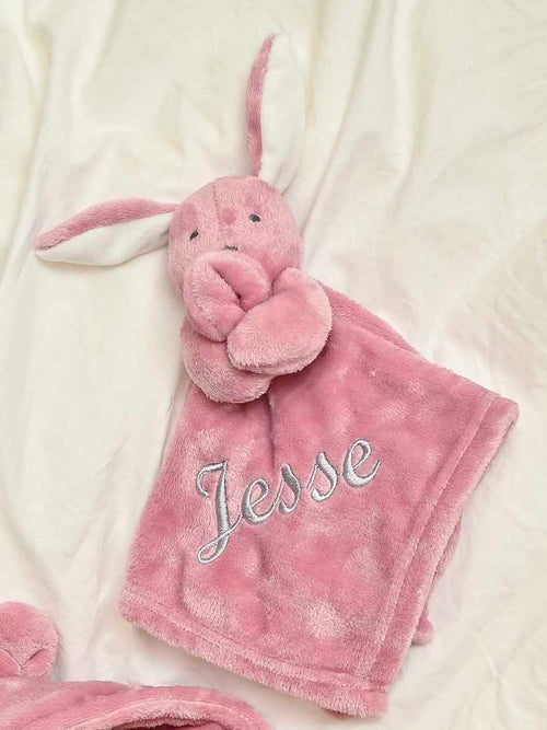 our Babies personalised bunny comforter in Dusky Pink is crafted from super soft plush material, this comforter will keep your baby snug and content. Complete with your babies name personalised/embroidered to the front.