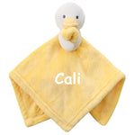 Load image into Gallery viewer, A personalised little duck comforter soft plush material in yellow, with embroidered personalised detailing set neatly across the front of the white duck. The duck is attached with a  yellow beak and cute stitched eyes, this would make such a sweet little gift. 
