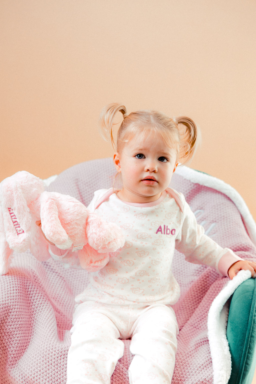 A sweet little set of bay/toddler girls personalised pyjama set white with light pink elephant print design  with matching light pink cuffs. Personalised on the left chest with the name in pink. A lovely soft pyjama set which would be a great addition to any littles ones bed time wardrobe. 