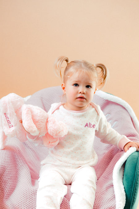 A sweet little set of bay/toddler girls personalised pyjama set white with light pink elephant print design  with matching light pink cuffs. Personalised on the left chest with the name in pink. A lovely soft pyjama set which would be a great addition to any littles ones bed time wardrobe. 