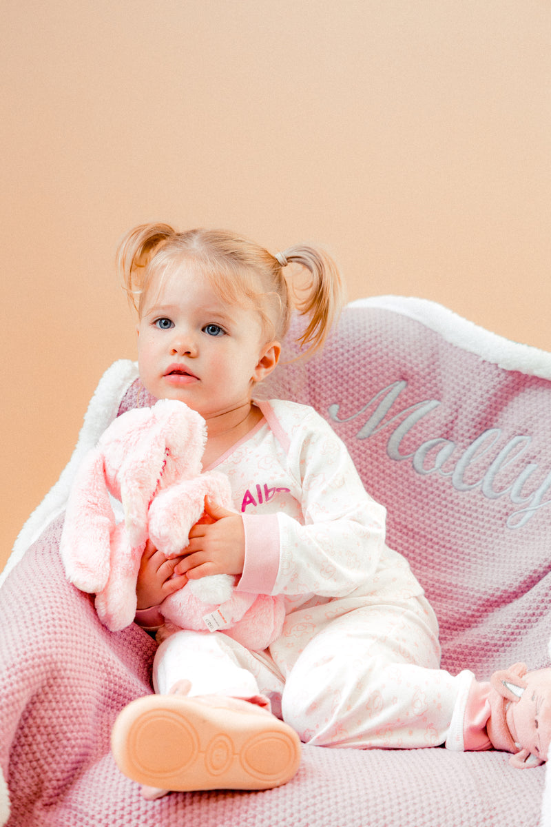 A sweet little set of bay/toddler girls personalised pyjama set white with light pink elephant print, with matching light pink cuffs. Personalised on the left chest with the name in pink. A lovely soft pyjama set which would be a great addition to any littles ones bed time wardrobe. 