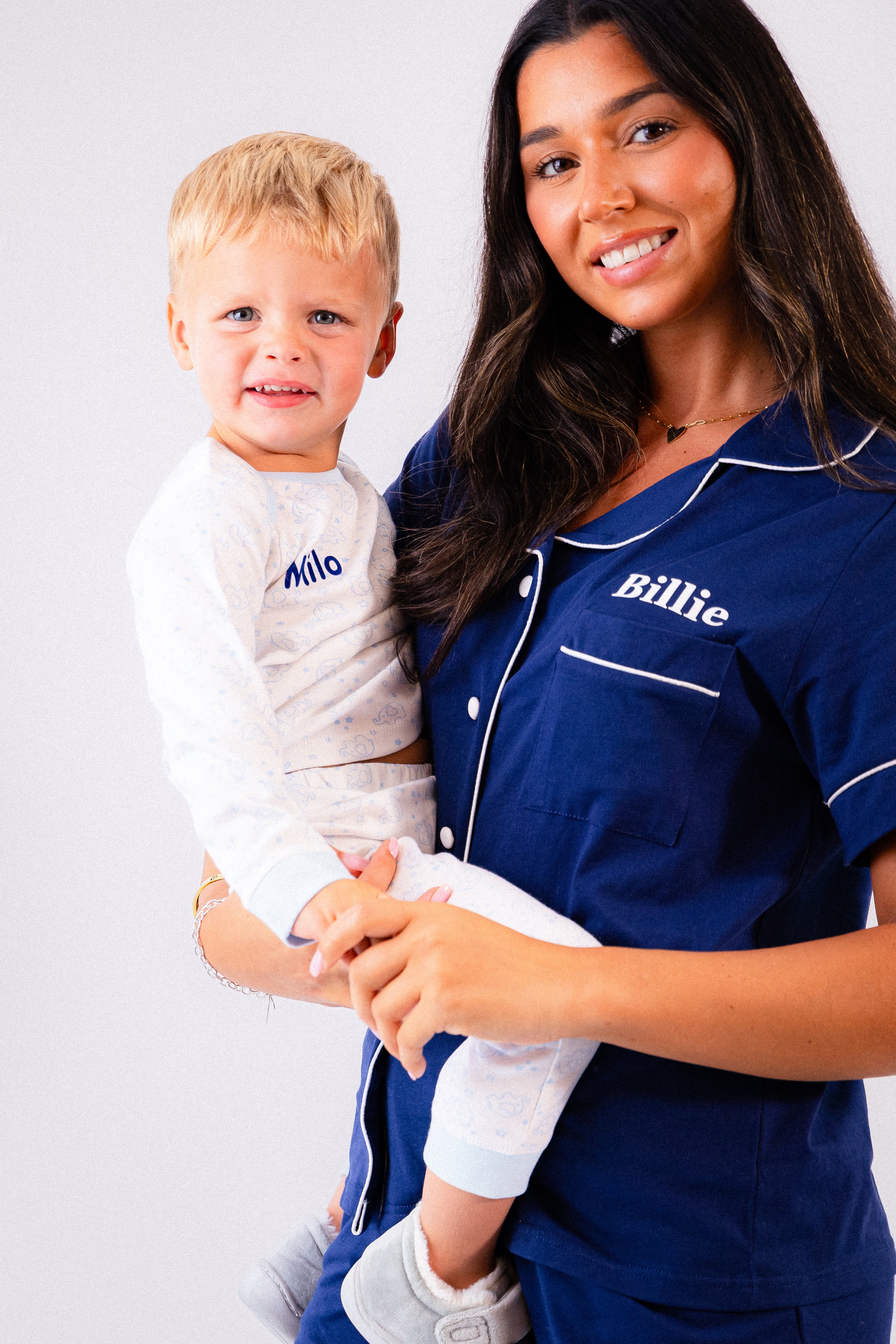 Baby/toddlers personalised pyjamas white with light blue elephant print, with matching light blue cuffs. Personalised on the chest with the name in blue. Lovely soft pyjamas a great addition to any littles ones bed time wardrobe. 