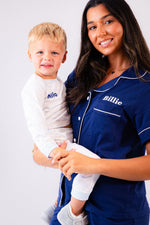 Load image into Gallery viewer, Baby/toddlers personalised pyjamas white with light blue elephant print, with matching light blue cuffs. Personalised on the chest with the name in blue. Lovely soft pyjamas a great addition to any littles ones bed time wardrobe. 
