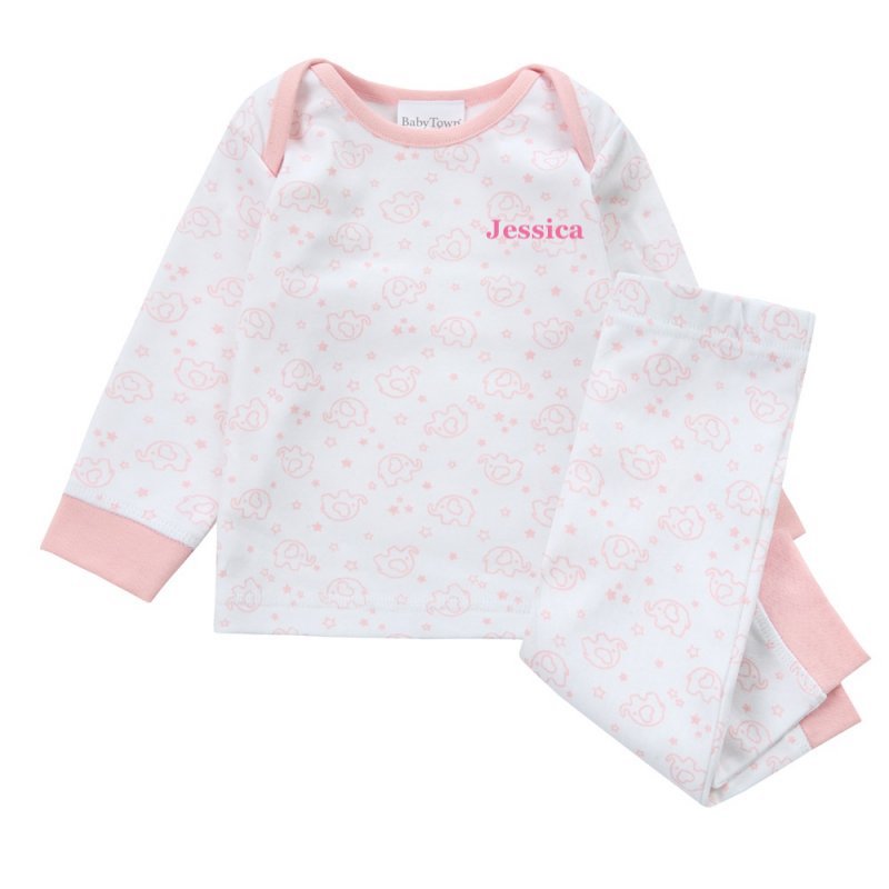 A sweet little set of baby/toddler girls personalised pyjama set white with light pink elephant print, with matching light pink cuffs. Personalised on the left chest with the name in pink. A lovely soft pyjama set which would be a great addition to any littles ones bed time wardrobe. 