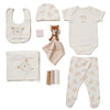 A collection of baby items including a bib, body vest, hat, leggings, blanket, muslins, teddy bear comforter, and all presented in a lovely mesh gift bag. A personalised a teddy bear beige design soft cotton comfortable set, perfect for a baby shower gift or any new arrival!  