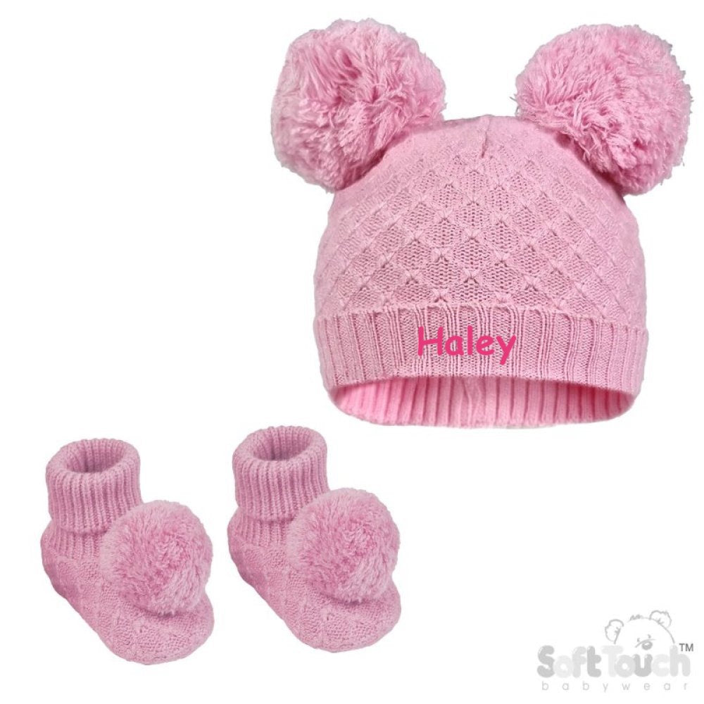 Baby girl pink cable knitted hat and bootees personalised soft cotton in a lovely pink colour. The hat and bootees both complete with cute pom pom's. A perfect gift to keep those little ones warm through those colder months.
