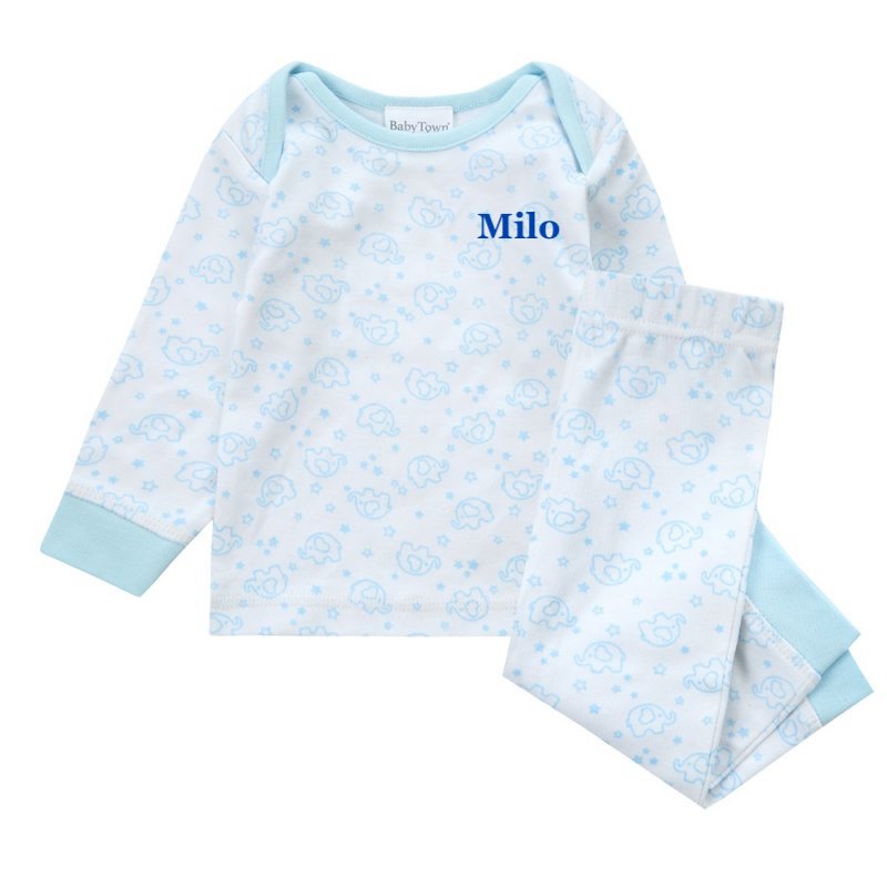 Baby/toddlers personalised pyjama set white with light blue elephant print, with matching light blue cuffs. Personalised on the left chest with the name in blue. A lovely soft pyjama set which would be a great addition to any littles ones bed time wardrobe. 