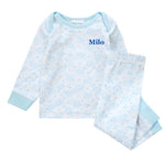 Load image into Gallery viewer, Baby/toddlers personalised pyjama set white with light blue elephant print, with matching light blue cuffs. Personalised on the left chest with the name in blue. A lovely soft pyjama set which would be a great addition to any littles ones bed time wardrobe. 
