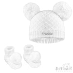 Load image into Gallery viewer, Baby unisex cable knitted hat and bootees personalised on the front of the hat. Soft cotton in a lovely white colour. The hat and bootees both complete with cute pom pom's. A perfect gift to keep those little ones warm through those colder months.
