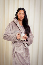 Load image into Gallery viewer, Boys plush maxi personalised dressing gown in a luxurious Mink colour. Made from super soft thick fabric, maxi length, large hood to the back and adjustable tie around the waist. Complete with a special touch of personalisation to the chest - this is embroidered especially for you. Making the perfect personalised gift for children. 
