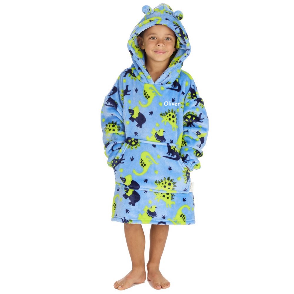Kid wearing dinosaur print hoody in blue, personalised on the chest. Hood with angaroo pocket to the front. 