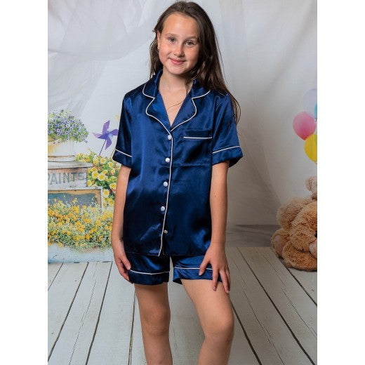 Kids navy satin pyjamas. Button up shirt with your personalised name above the pocket with matching shorts. Body colour navy with a contrast piping and buttons. Personalised for you! 