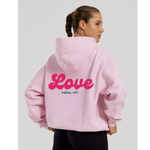 Load image into Gallery viewer, Ladies light pink oversized hoodie with bright pink printed bold curved &#39;Love&#39; writing on the back with a subtle black printed Lulabay -vol 1 neatly underneath. A nice comfortable hoody ideal to wear daily or even at the gym ! 
