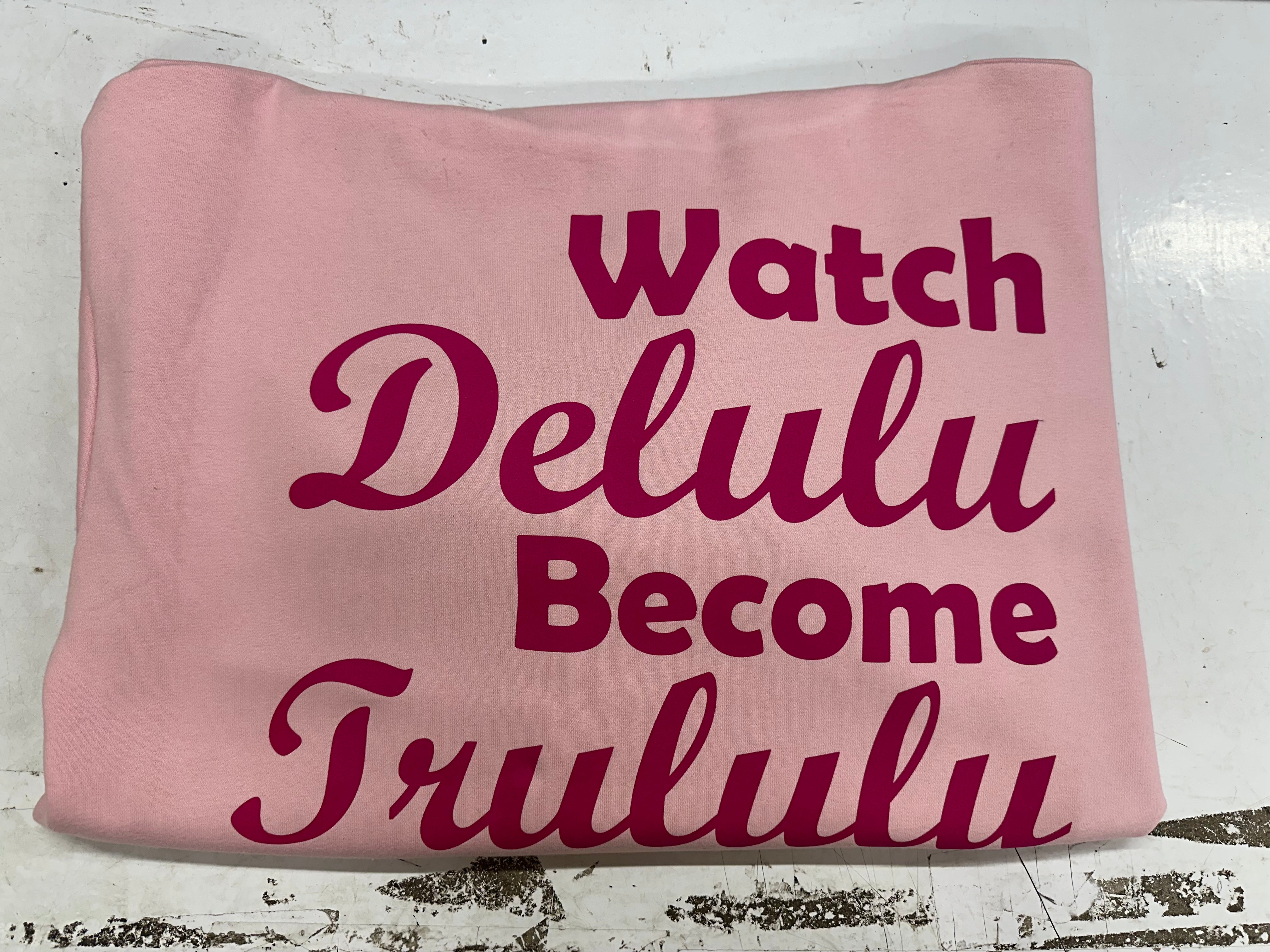 A comfortable ladies oversized light pink cotton hoodie with a printed design in a curvy hot pink printing to the left chest on the front  ... Watch Delulu become Trululu... A catchy design sure to catch peoples eye ! 