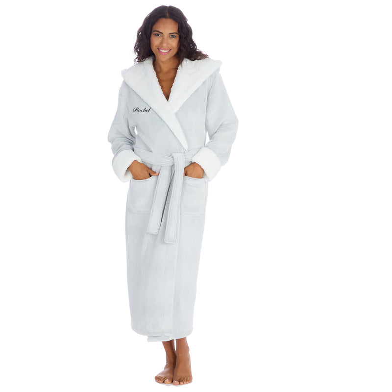 Women personalised dressing gown in a frosted light grey colour with white borg trim in the hood and front panel. Pockets on either side, adjustable tie around the waist and hood to the back. The personalisation will be to the chest and of your choosing - this will be embroidered. 