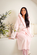 Load image into Gallery viewer, Ladies plush maxi personalised dressing gown in a luxurious Light Pink colour. Made from super soft thick fabric, maxi length, large hood to the back and adjustable tie around the waist. Complete with a special touch of personalisation to the chest - this is embroidered especially for you. Making the perfect personalised gift for her. 
