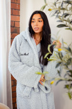 Load image into Gallery viewer, Ladies premium maxi personalised dressing gown in a luxurious Ice Blue colour. Made from super soft thick fabric, maxi length, large hood to the back and adjustable tie around the waist. Complete with a special touch of personalisation to the chest - this is embroidered especially for you. Making the perfect personalised gift for her. 
