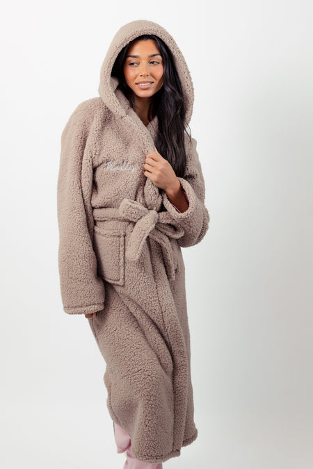 Ladies premium maxi personalised dressing gown in a luxurious Mink colour. Made from super soft thick fabric, maxi length, large hood to the back and adjustable tie around the waist. Complete with a special touch of personalisation to the chest - this is embroidered especially for you. Making the perfect personalised gift for her. 