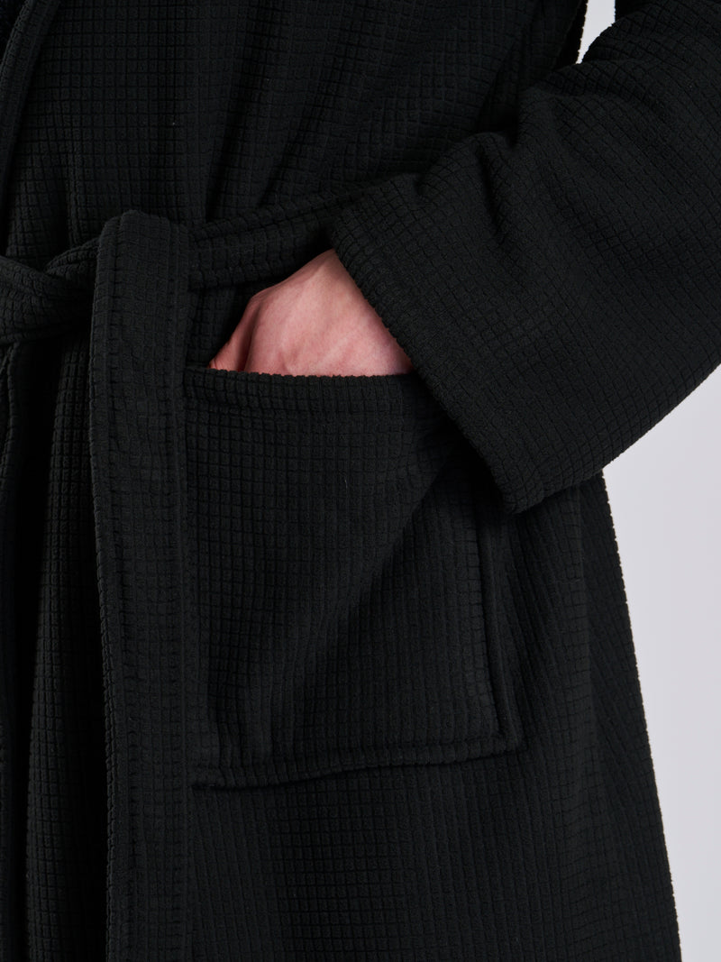 Here we have from the mens collection a personalised waffle material with Borg lining black dressing gown. You could have this embroidered with a name of your choice - embroidered in a white cotton. It has a Borg lined hood, two front pockets and a wrap around tie at the waist. What a great personalised gift such a great way to keep warm on the colder evenings. 