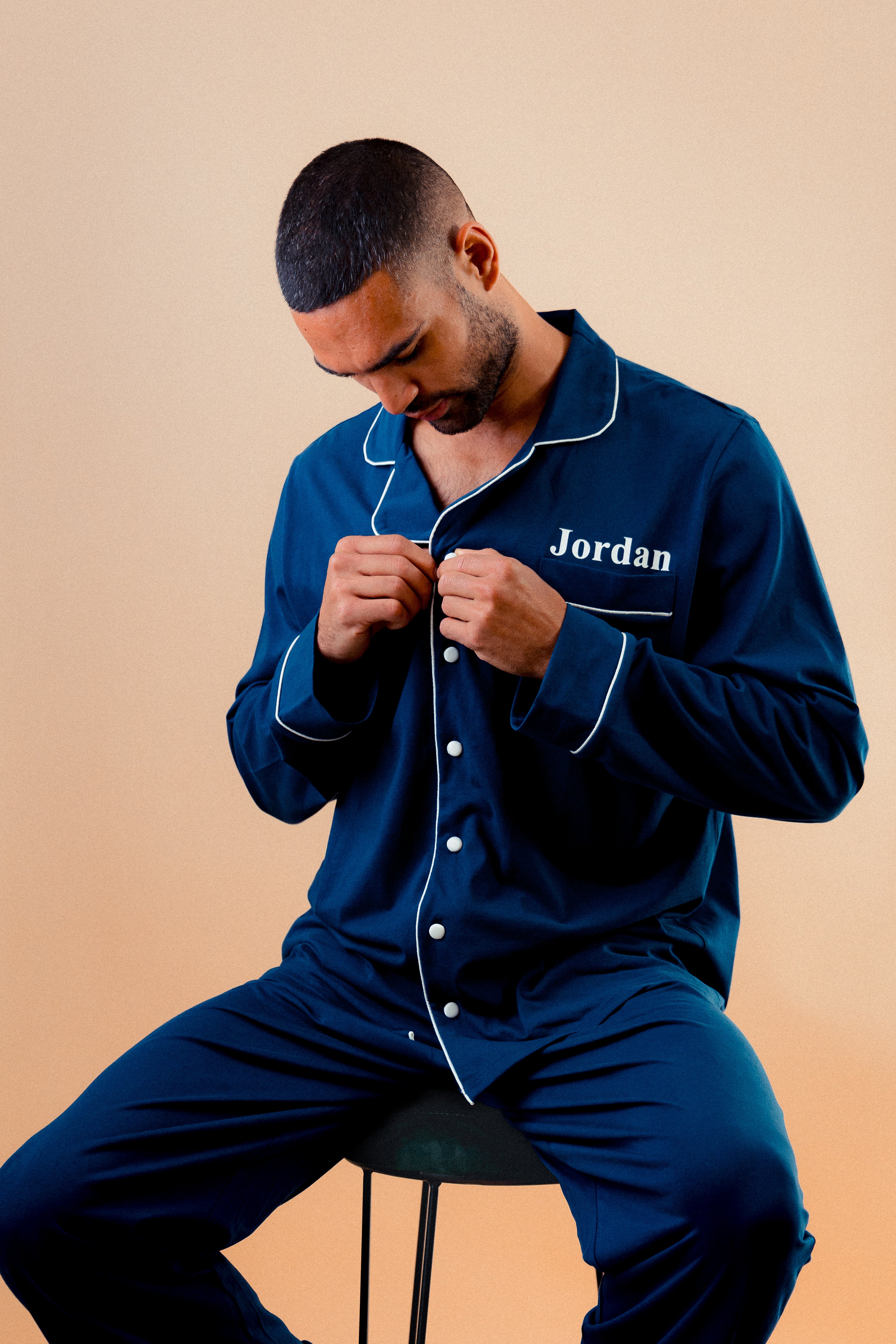 Mens jersey button up personalised pyjama in a lovely Navy colour with White trims, buttons and personalisation. 