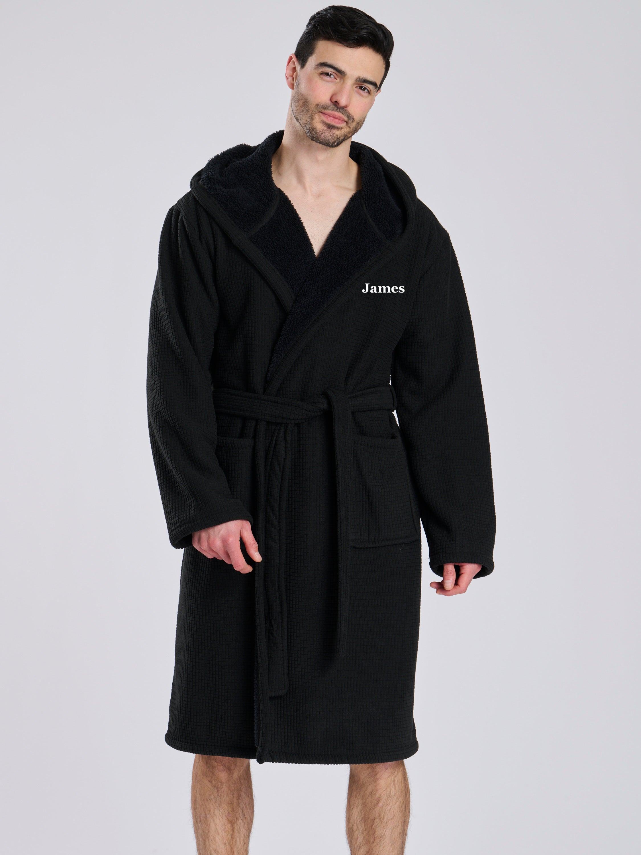 Here we have from the mens collection a personalised waffle material with Borg lining black dressing gown. You could have this embroidered with a name of your choice - embroidered in a white cotton. It has a Borg lined hood, two front pockets and a wrap around tie at the waist. What a great personalised gift such a great way to keep warm on the colder evenings. 