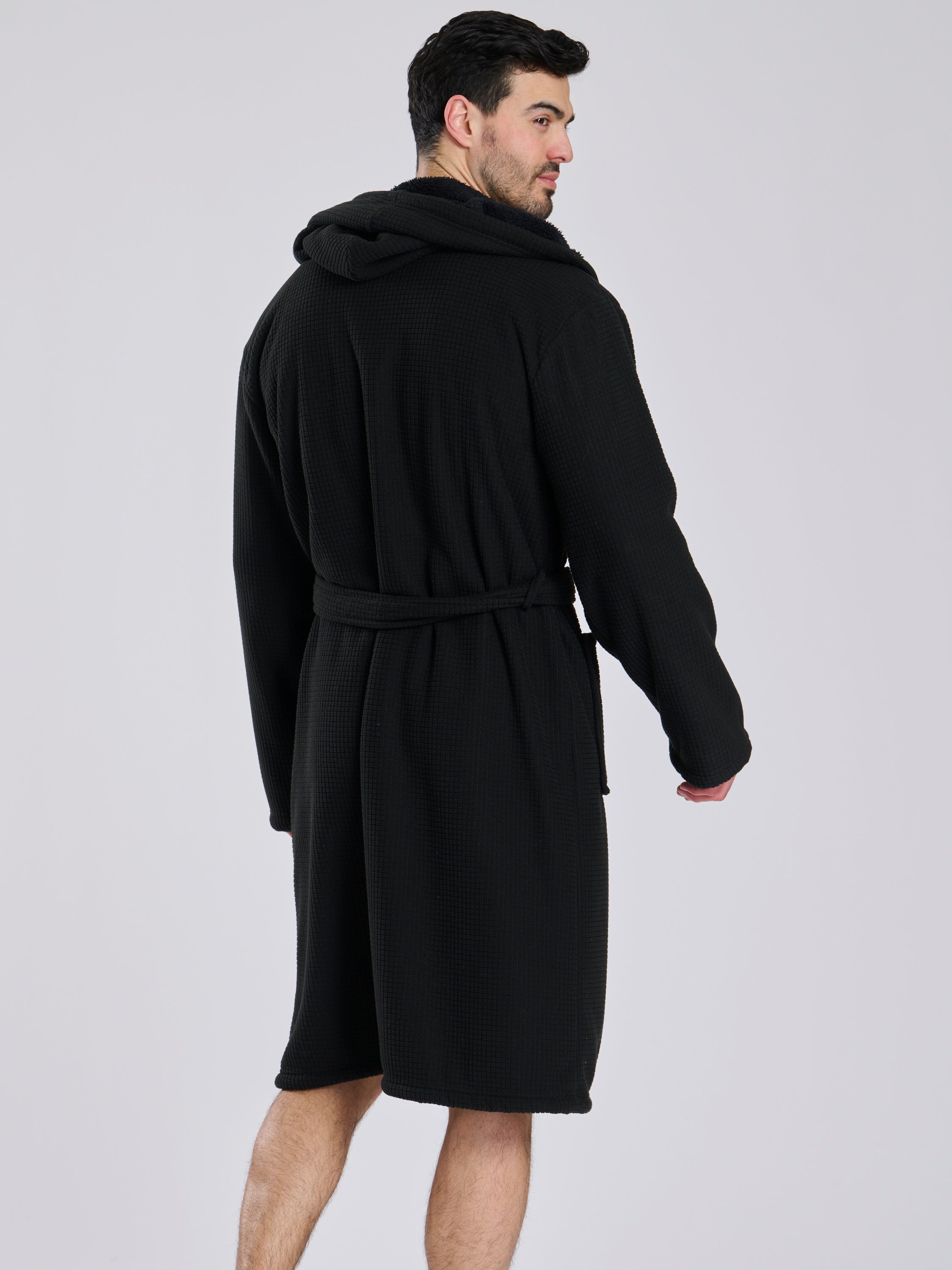 Here we have from the mens collection a personalised waffle material with borg lining black dressing gown. You could have this embroidered with a name of your choice - embroidered in a white cotton. It has a Borg lined hood, two front pockets and a wrap around tie at the waist. What a great personalised gift such a great way to keep warm on the colder evenings. 