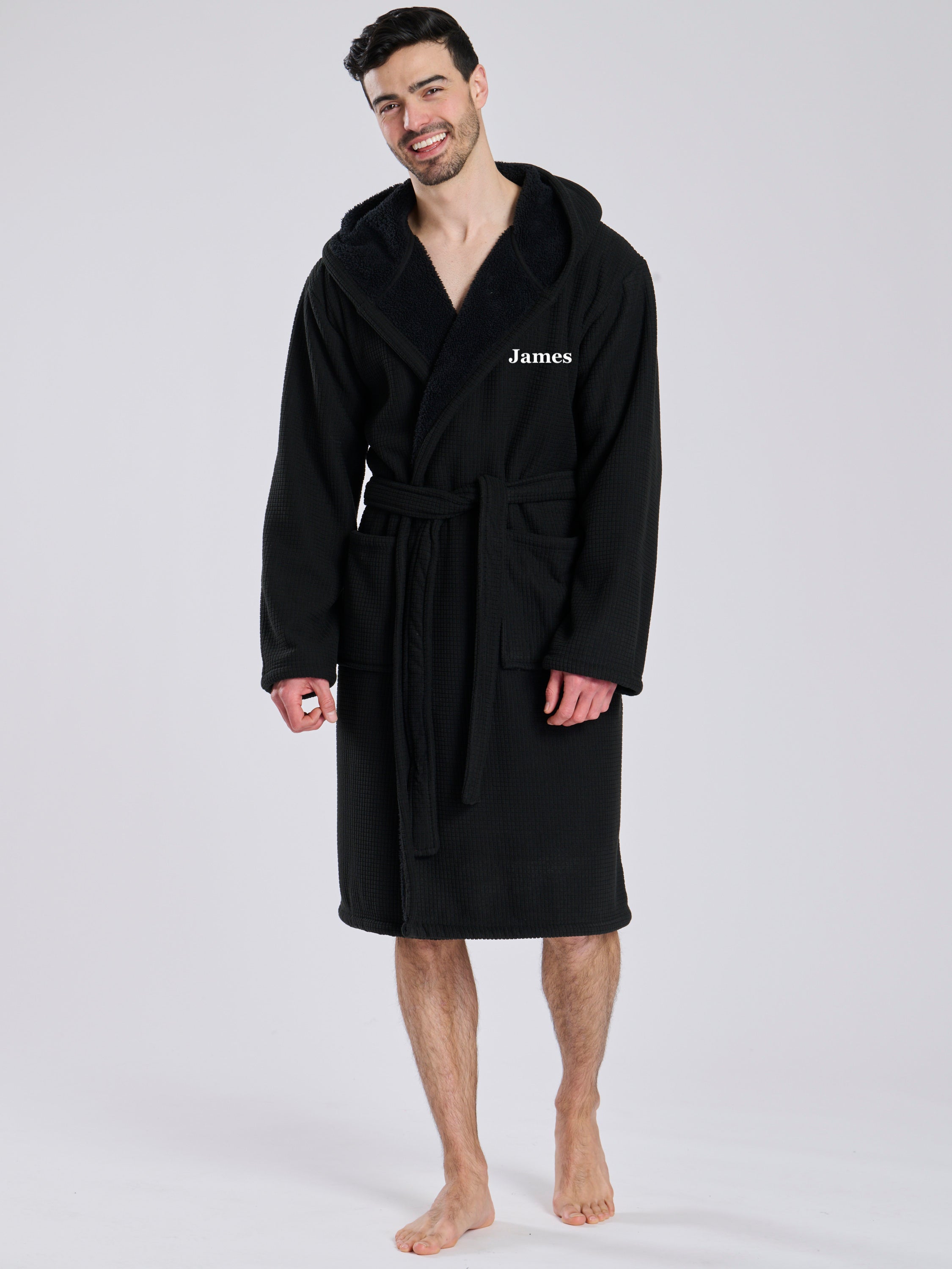 Here we have from the mens collection a personalised waffle material with Borg lining black dressing gown. You could have this embroidered with a name of your choice - embroidered in a white cotton. It has a Borg lined hood, two front pockets and a wrap around tie at the waist. What a great personalised gift such a great way to keep warm on the colder evenings. 