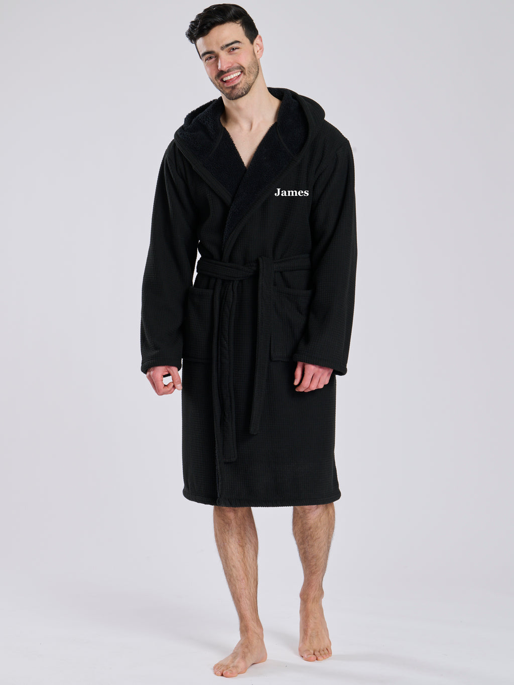 Here we have from the mens collection a personalised waffle material with Borg lining black dressing gown. You could have this embroidered with a name of your choice - embroidered in a white cotton. It has a Borg lined hood, two front pockets and a wrap around tie at the waist. What a great personalised gift such a great way to keep warm on the colder evenings. 