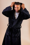 Mens plush maxi personalised dressing gown in a luxurious plush Navy colour. Made from super soft thick fabric, maxi length, large hood to the back and adjustable tie around the waist. Complete with a special touch of personalisation to the chest - this is embroidered especially for you. Making the perfect personalised gift for him. 