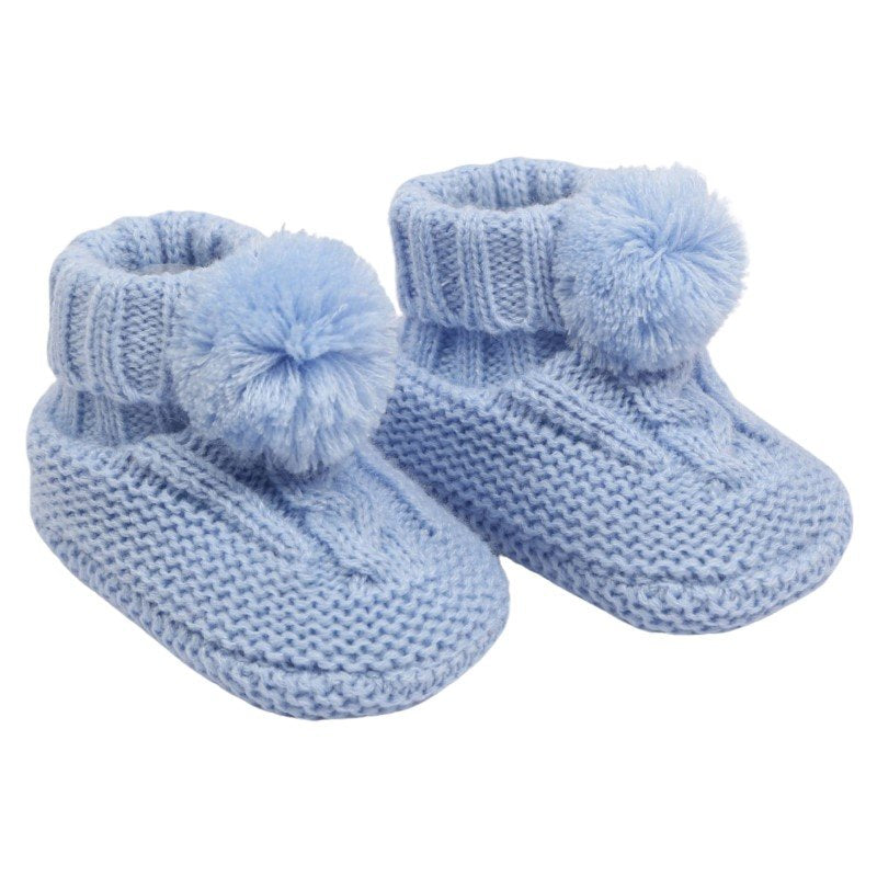 baby cable knit pom pom bootees | unisex knitted baby bootees | cable knit baby booties with pom poms | cosy newborn knitted bootees