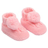 baby cable knit pom pom bootees | unisex knitted baby bootees | cable knit baby booties with pom poms | cosy newborn knitted bootees
