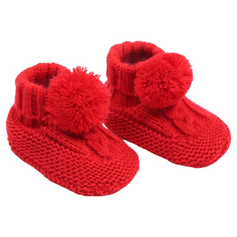 baby cable knit pom pom bootees | unisex knitted baby bootees | cable knit baby booties with pom poms | cosy newborn knitted bootees
