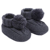 baby cable knit pom pom bootees | unisex knitted baby bootees | cable knit baby booties with pom poms | cosy newborn knitted bootees