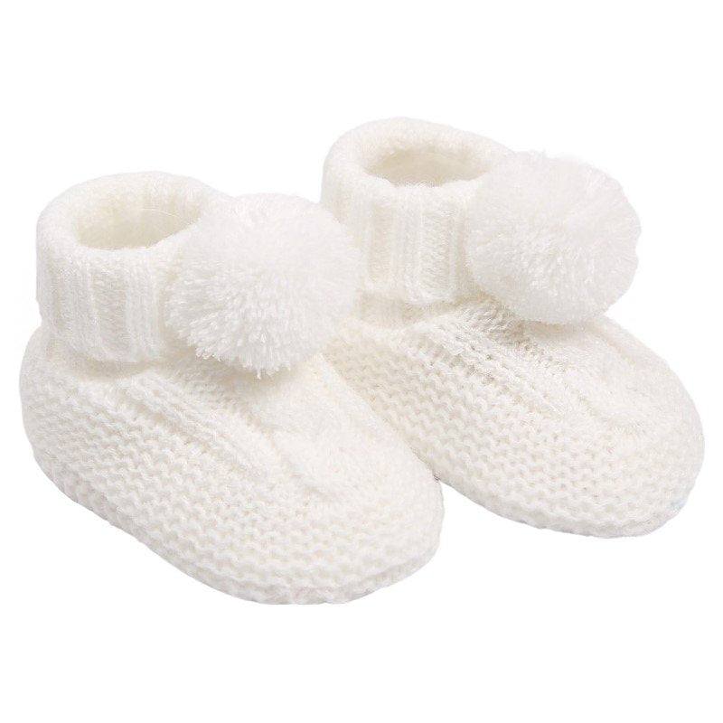 baby cable knit pom pom bootees | unisex knitted baby bootees | cable knit baby booties with pom poms | cosy newborn knitted bootees