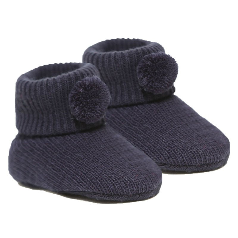 newborn baby pom pom bootees | knitted newborn baby booties | cosy pom pom baby booties | soft acrylic newborn bootees