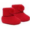 newborn baby pom pom bootees | knitted newborn baby booties | cosy pom pom baby booties | soft acrylic newborn bootees