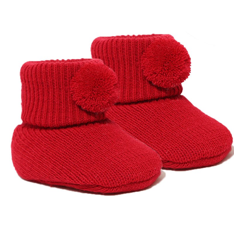 newborn baby pom pom bootees | knitted newborn baby booties | cosy pom pom baby booties | soft acrylic newborn bootees